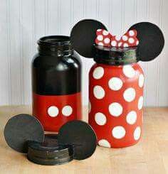 two mason jars with minnie mouse ears and polka dot lids, one has a red bow on it