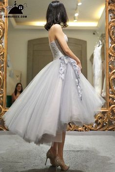 High Low Grey Tulle Strapless Wedding Party Dress Tea Length with Petals Tulle Skirt With Train, Tulle Tea-length Wedding Dress, Strapless Tulle Wedding Dress With Sweetheart Neckline, Wedding Strapless Dress With Fitted Bodice In Organza, Strapless Tulle Evening Dress For Wedding, Tulle Strapless Dress For Wedding, Strapless Tulle Dress For Wedding, Organza Strapless Dress With Fitted Bodice For Wedding, Wedding Strapless Tulle Dress