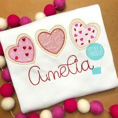 embroidered name with hearts and balloons on it