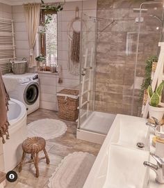 a bathroom with a washer and dryer next to a tub in the corner