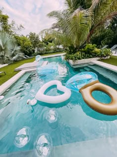 an inflatable water slide sits on the edge of a swimming pool