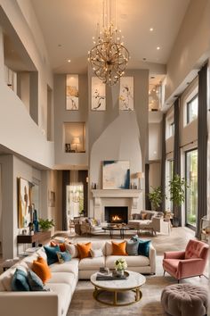 a living room filled with lots of furniture and a chandelier hanging from the ceiling