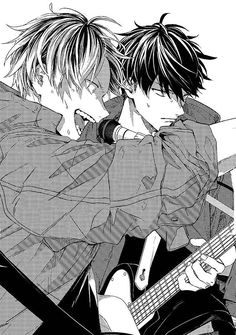 two young men are hugging while playing guitar