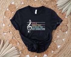 a t - shirt that says it's a great day to read the key signature