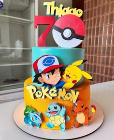 a birthday cake with pokemon characters on it