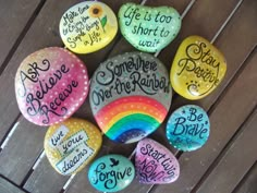 painted rocks with sayings on them are arranged in a circle