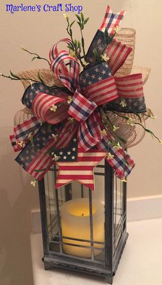 a lantern with an american flag bow on it