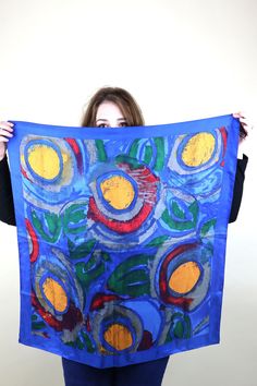 "A beautiful 90's Vintage scarf from Perry Ellis with a wonderful abstract print of Yellow orange circles and swaths of blue green. Sure to be a Statement piece to any outfit. The Fabric is a Feels like a  lightweight Silk. The large square shape makes it perfect for use around the neck, as a headscarf, or even an ascot or hair accessory. SCARF MEASUREMENTS (in Inches) Width: 30.5 Length: 30.5\" **all Measurements are taken with the garment lying flat, then doubled. Be sure to leave room for movement and comfort** CONDITION: VINTAGE GOOD: Good condition, some visible wear but no serious flaws to make note of. LABEL: Perry Ellis MATERIALS: unknown, but feels like silk *Please See FAQ for more details on how I take measurements and other common questions Feel free to convo me for any questio Circle Print, Perry Ellis, Vintage Scarf, Blue And Yellow, Head Scarf, Print Gifts, Abstract Print, Statement Pieces, Circles