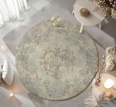 a round rug on the floor next to candles