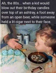 a little boy is blowing out the candles on his birthday cake