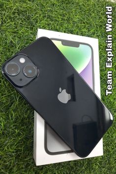 an iphone 11 pro in its box on the grass with it's new battery cover