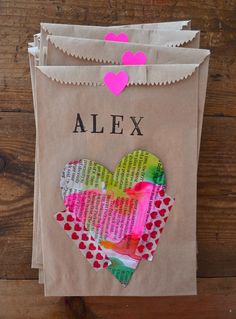 a paper bag that has been made to look like a heart with the word alex on it