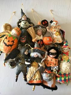 a bunch of halloween ornaments hanging on the wall