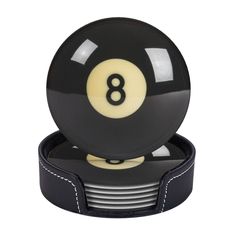 a black and white eight ball coaster with the number 8 on it's side