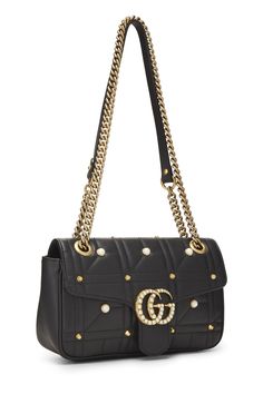 Find GUCCI Faux Pearl Matelassé Leather Marmont Shoulder Bag on Editorialist. The Gucci Marmont Shoulder Bag features a quilted matelassé leather exterior with faux pearl embellishments. The bag is accented with a gold-tone GG hardware and a chain strap. The bag has a flap top closure with a turn lock. It comes with a small size and can be worn on the shoulder or crossbody. Bottega Veneta Shoulder Bag, Laura Geller, Cow Boy, Gucci Black, Vuitton Bag, Diaper Backpack, Issey Miyake, Thom Browne, Baby Bag