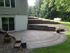 an outdoor patio with steps leading up to it