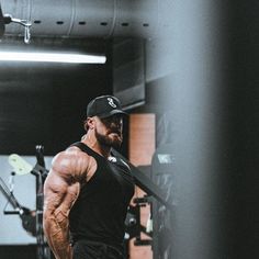 a man standing in the middle of a gym