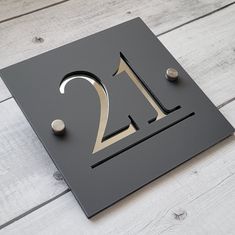 a metal sign with the number twenty two on it