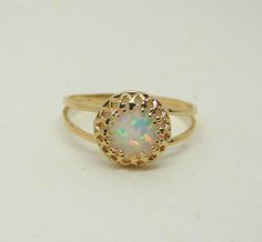 Opal ring / Opal jewellery / Blue opal ring / Gold Filled opal ring / Dainty ring . White opal ring / October birthstone ring Ring features: - Opal measures 8mm - All components are 100% gold filled / sterling silver Gold filled is an actual layer of gold-pressure bonded to another metal. Gold filled is not to be confused with gold plating as filled literally has 100% more gold than gold plating. Gold filled is much more valuable and tarnish resistant. It does not flake off, rub off or turn colo Round Opal Gemstone Ring, Opal Ring With Round Stone, Opal Birthstone Ring With Round Stone, Opal Birthstone Ring Round Cut, Opal Cabochon Round Rings, Adjustable Opal Ring, Opal Ring Gift, Round Opal Ring For Gift, Opal Ring Gift With Round Band