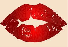 a red lipstick with the shape of a fish on it's lip and bottom