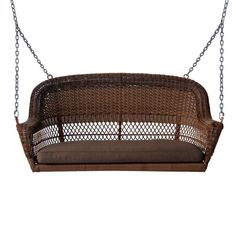 a brown wicker swing chair hanging from a chain