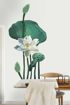 a white flower sitting on top of a wooden table