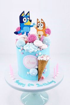 a birthday cake decorated with cartoon characters and ice cream cones