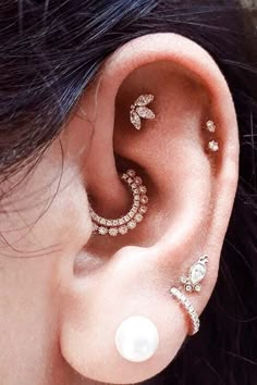 a close up of a person with ear piercings on their left and right sides