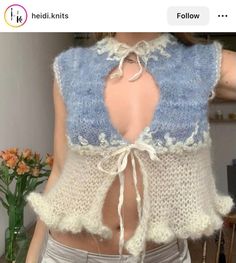 the back of a woman's top that has been crocheted