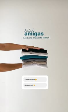 an ad for armgass showing two hands holding folded clothes and pointing at the screen