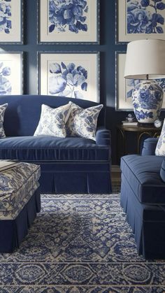 a living room filled with blue and white furniture