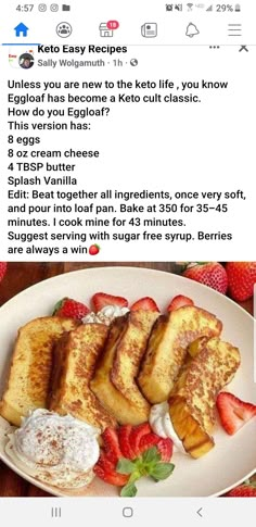 a white plate topped with french toast and strawberries