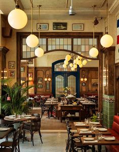 the interior of a restaurant with tables and chairs