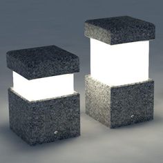 two black and white blocks with lights on them