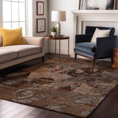 a living room filled with furniture and a fire place next to a window on top of a hard wood floor