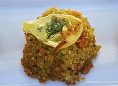 a white plate topped with rice and vegetables