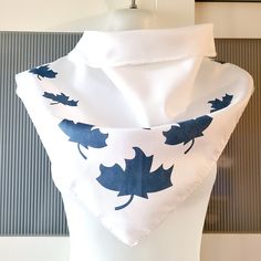 This is a lovely triangle scarf that can be used as a neck wrap, headband, hair tie, bag decor, etc. The scarf is white with a blueish grey maple leaves design. The scarf is thick polyester and it is in excellent/mint condition. The scarf will make a beautiful gift. It comes in a gift wrap and with a 'Thank you' card. For more scarves in my store visit: https://www.etsy.com/ca/shop/NostalgicByLiliya?ref=seller-platform-mcnav&section_id=25031148 For other items visit: https://nostalgicbyliliya.et Elegant White Bandana Scarf, Elegant White Bandana, White One Size Silk Scarf For Gift, White Silk Scarf As A Gift, White Silk Scarf For Gift, Women Sweater Dress, Wrap Headband, Leaves Design, Triangle Scarf