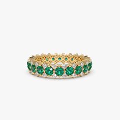 Made to Order Gold Kt: 14K Available Gold Color: Rose Gold, Yellow Gold, White Gold Round Diamond: 44 Pcs 1.3MM Round Emeralds: 22 pcs 2.7MM Total Diamond CTW: 0.50ctw Total Emerald CTW: 2.10ctw Diamond Color Clarity: G Color SI Clarity Emerald Ring White Gold, Emerald Ring Design, Ruby Ring Designs, Emerald Anniversary, Emerald Eternity Band, Emerald Wedding Band, Oval Solitaire Engagement Ring, Emerald Ring Vintage, Emerald Ring Gold