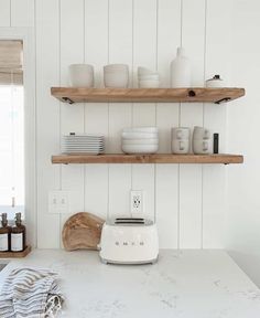 the kitchen counter is clean and ready to be used for baking or servings,