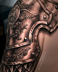 a man's arm is covered in armor