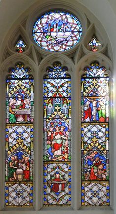 a large stained glass window in a church