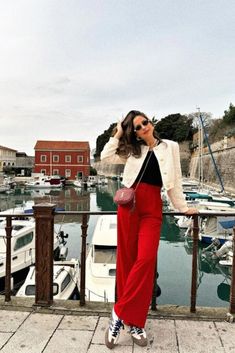 Red Trousers Outfit Christmas, White And Red Outfits For Women, Red Satin Pants Outfit, Red Pants Christmas Outfit, Red Pant Outfits, Red Dress Pants Outfit, Red Trousers Outfit Casual, Red Pants Outfit Aesthetic, Red Pants Outfit Summer