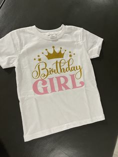 This beautiful t shirt is made to order. This  T shirt is made with a beautiful gold glitter and a soft pink vinyl. Pink T-shirt For Birthday, Pink Birthday T-shirt With Name Print, Pink T-shirt With Name Print For Birthday, Pink Glitter Print Top For Birthday, Cute Pink T-shirt For Birthday Gift, Pink Glitter Print Short Sleeve T-shirt, Personalized Pink T-shirt For Birthday, Gold Letter Print T-shirt For Birthday, Pink Graphic Tee For Birthday