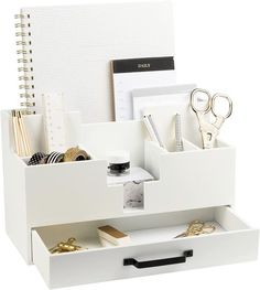 a white desk organizer with office supplies in it