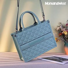 Add a touch of sophistication to your workday with Montana West Work Tote Bags Quilted Handbags. Crafted with a stylish quilted design, these spacious tote bags offer the perfect balance of elegance and functionality. Ideal for professionals on the go, they feature multiple compartments to keep your essentials organized, whether it’s your laptop, documents, or personal items. The durable, high-quality material ensures lasting wear, while the chic, timeless design pairs effortlessly with both business and casual attire. Upgrade your office wardrobe with a Montana West tote—where fashion meets practicality! Office Wardrobe, Work Tote Bag, Quilted Handbags, Work Tote, Casual Attire, New Handbags, The Chic, Montana, The Go