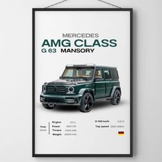 the mercedes amg class poster is hanging on the wall above it's black frame