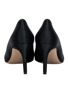 Step out in style with these Ferragamo pumps! In a sleek black satin material with a pointed toe and bow front, they'll pair perfectly with a fancy party dress. Your feet will be ready for any social season event! Size 8 Made in Italy Satin upper Leather lining and sole Black and gunmetal bow toe detail Pointed toe Minor blemishes on heel Heel height 3" Evening Pumps With 4-inch Heel And Round Toe, Fitted Heels With Satin Bow And Round Toe, Fitted Satin Bow Heels With Round Toe, Chic Heels With Satin Bow For Formal Occasions, Chic Formal Heels With Satin Bow, Pointed Toe Heels With Bow For Night Out, Fitted Court Shoes With 4-inch Heel For Events, Satin Heels With Satin Bow And Round Toe, Round Toe Heels With Satin Bow For Evening