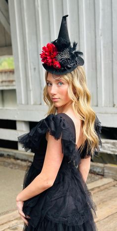 The perfect hat for Halloween!! Rich red and black colors and one of my favorite and most popular designs!  My daughter who's 15 loves to wear this one with the alligator clips attached under the brim so you can wear it centered or propped to the side.   Another popular way is our fabric lined u shaped flexible headband {one size fits most). This hat is sure to be a hit at parties!! Any questions please ask! Fun  black red witch  hat with rolled satin flower, bird cage netting and feathers. Has a band of ruffles around the base of the hat!     ♥ I do accept custom orders if I'm not too busy with orders, so if you see something in my shop but want it slightly different, just let me know! I have a lot of colors/styles, I just haven't posted them all. ♥o Gothic Brimmed Costume Hats For Festivals, Red Witch Hat, Witch Headband, Flower Witch, Red Witch, Halloween Flowers, Flower Bird, Satin Flowers, Hat Baby