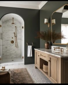 a bathroom with green walls and marble counter tops