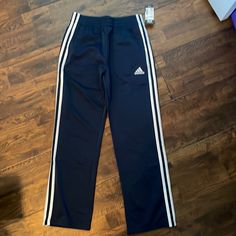 New With Tags Adidas Navy Blue Tricot Track Pants. Adidas Blue Sporty Sweatpants, Adidas Sporty Blue Sweatpants, Adidas Blue Sweatpants For Sports, Blue Adidas Cotton Sweatpants, Adidas Blue Cotton Sweatpants, Navy Adidas Sporty Pants, Adidas Navy Sporty Pants, Adidas Blue Sweatpants With Pockets, Adidas Sporty Navy Pants